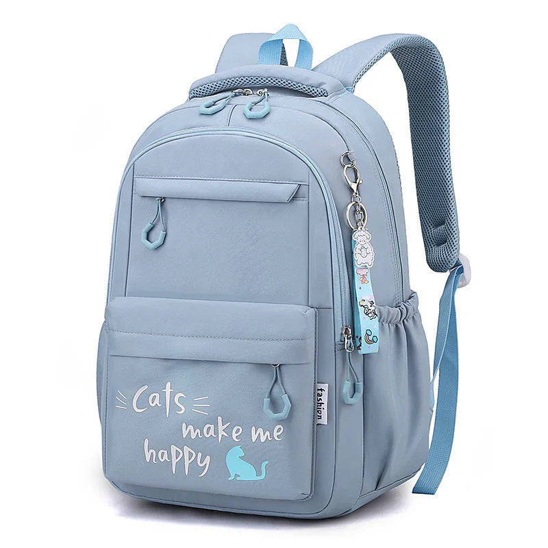 Light blue backpack with front pocket text 'Cats make me happy' and cute keychain charm