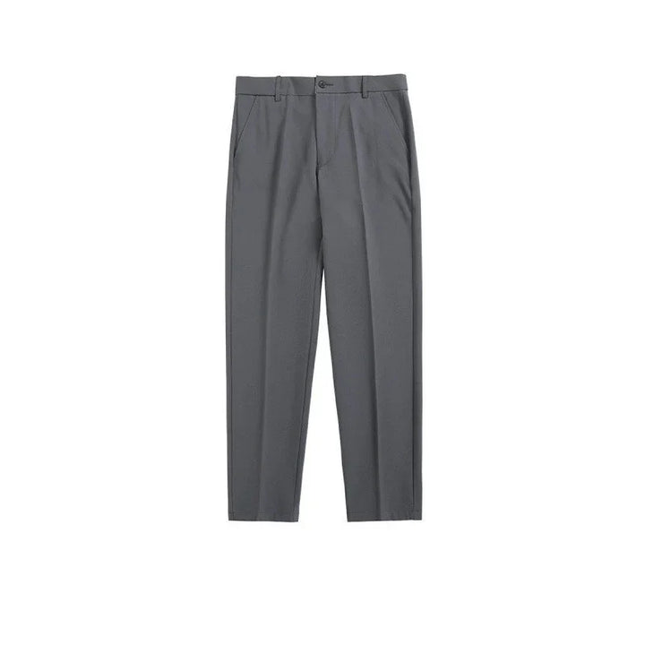Pair of gray formal trousers with front pockets and belt loops on white background