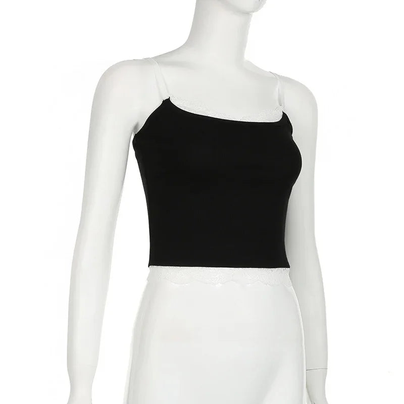 Black crop top with white lace trim on mannequin torso against white background