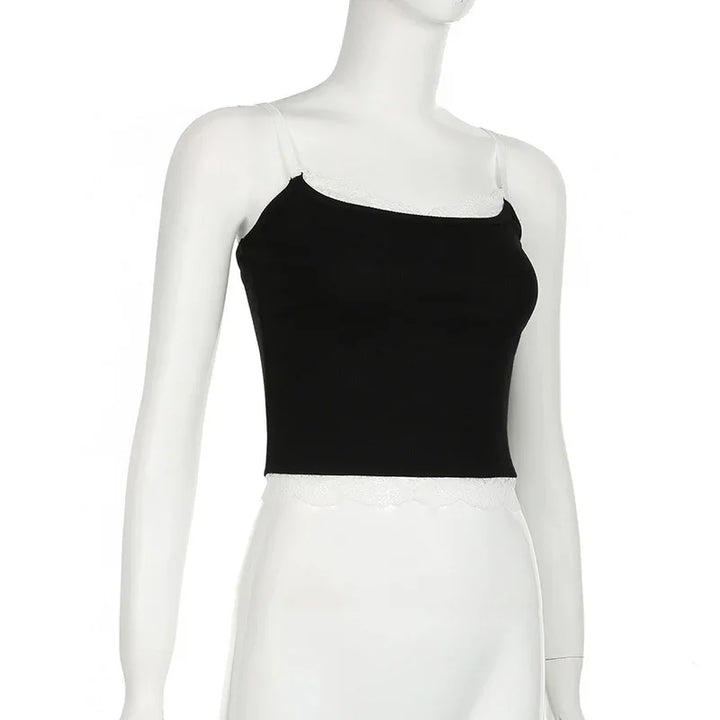 Black crop top with white lace trim on mannequin torso against white background