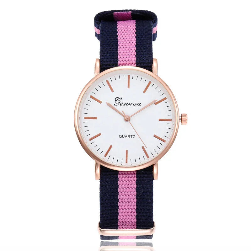 Geneva quartz wristwatch with rose gold case and navy blue and pink striped fabric strap