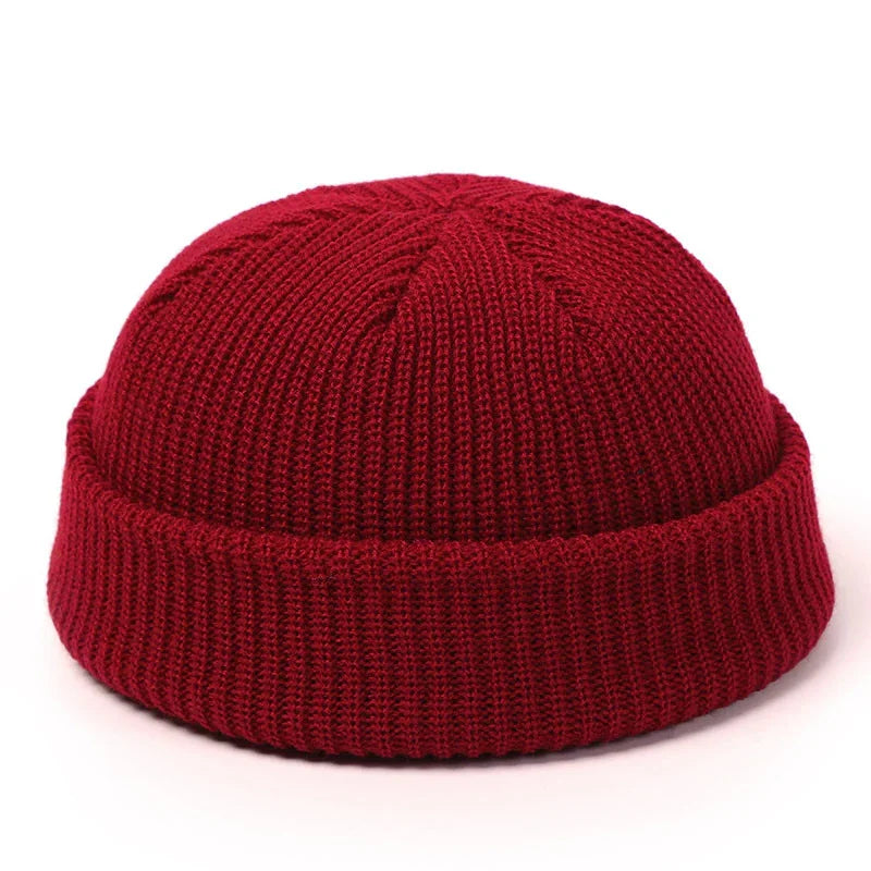 Red knitted beanie hat with folded cuff, simple warm winter headwear