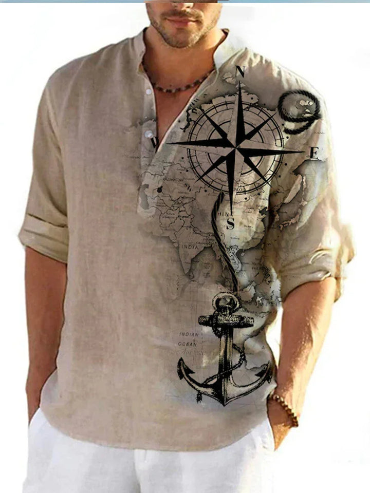 beige long-sleeve casual shirt with nautical compass and anchor map design on right side, worn by man