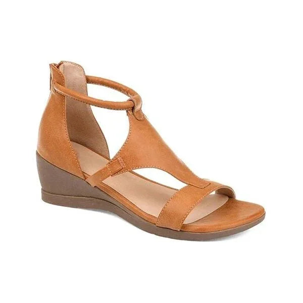 Tan leather women's wedge sandal with ankle strap and open toe on white background