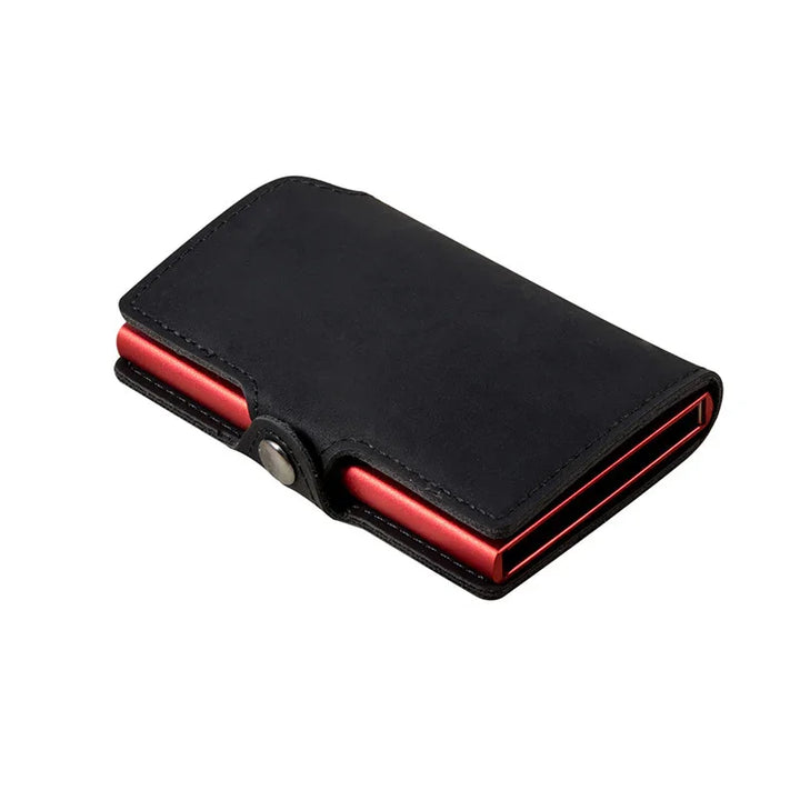 Black leather wallet with snap button closure and red metallic card holder inside