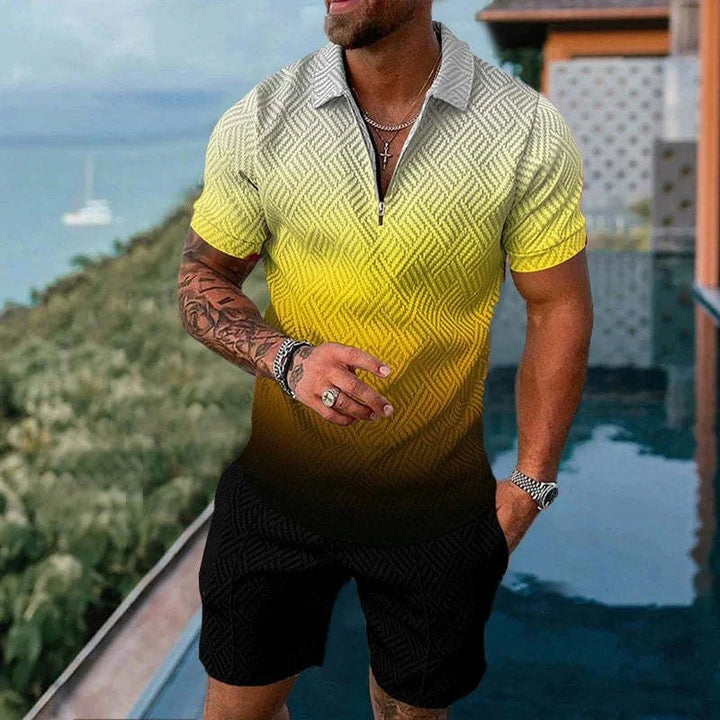 Man wearing yellow to black gradient short sleeve polo shirt with zipper and black shorts near pool and greenery