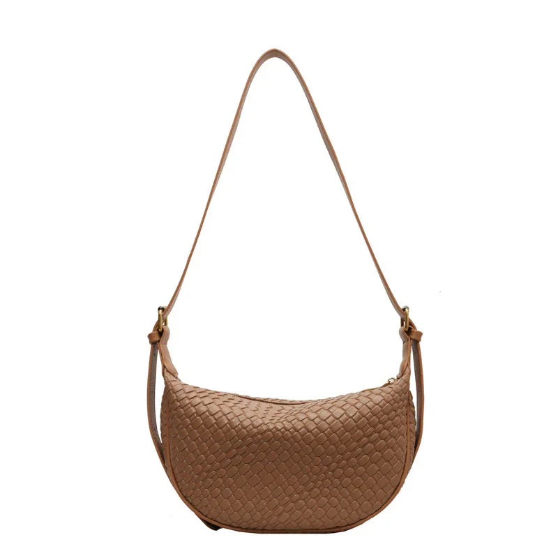 brown woven leather shoulder bag with adjustable strap on white background