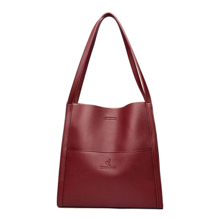 Red textured leather shoulder handbag with ZMBIRO logo on front pocket