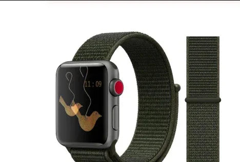 Apple Watch with dark green nylon loop band and bird graphic watch face on white background