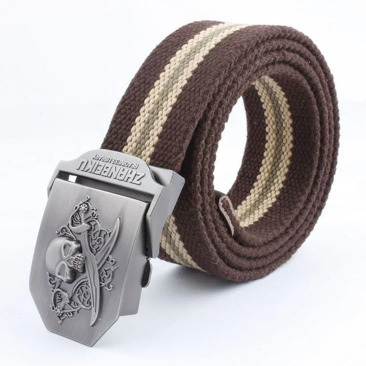 Brown and beige striped canvas belt with metal buckle featuring skull and swords design