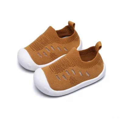 Brown toddler knit sneakers with white rubber soles and breathable cut-out design