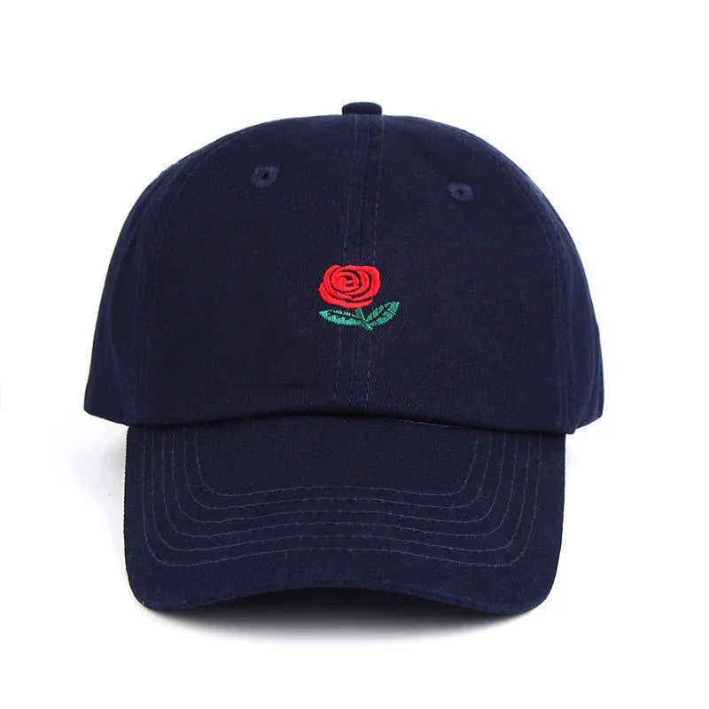 Navy blue baseball cap with embroidered red rose and green leaves on front