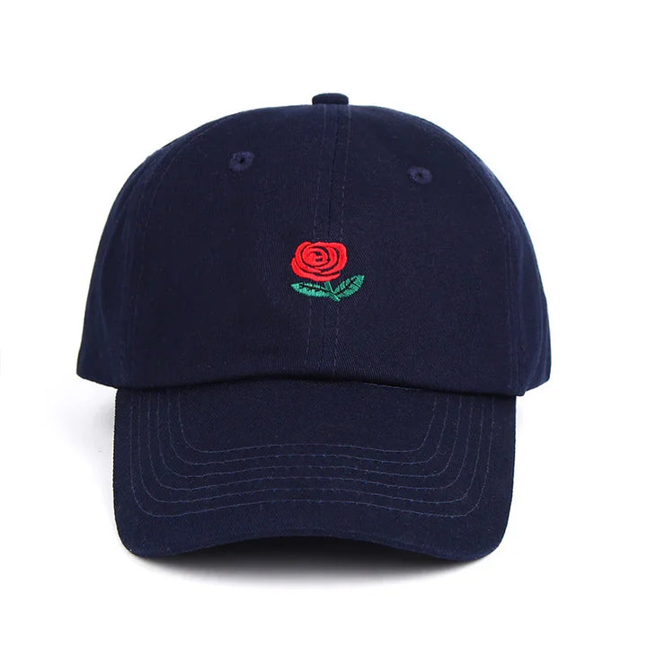 Navy blue baseball cap with embroidered red rose and green leaves on front