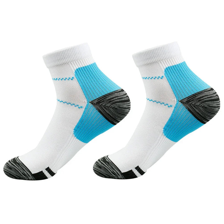 Pair of white ankle sports socks with blue arch support and black toe and heel accents