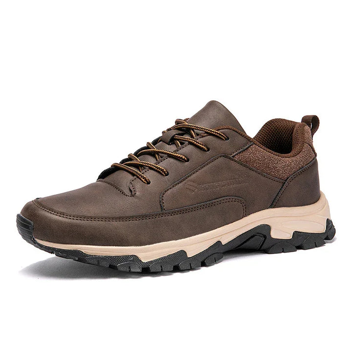 Brown men's casual sneaker with beige sole and black tread, lace-up design, cushioned collar