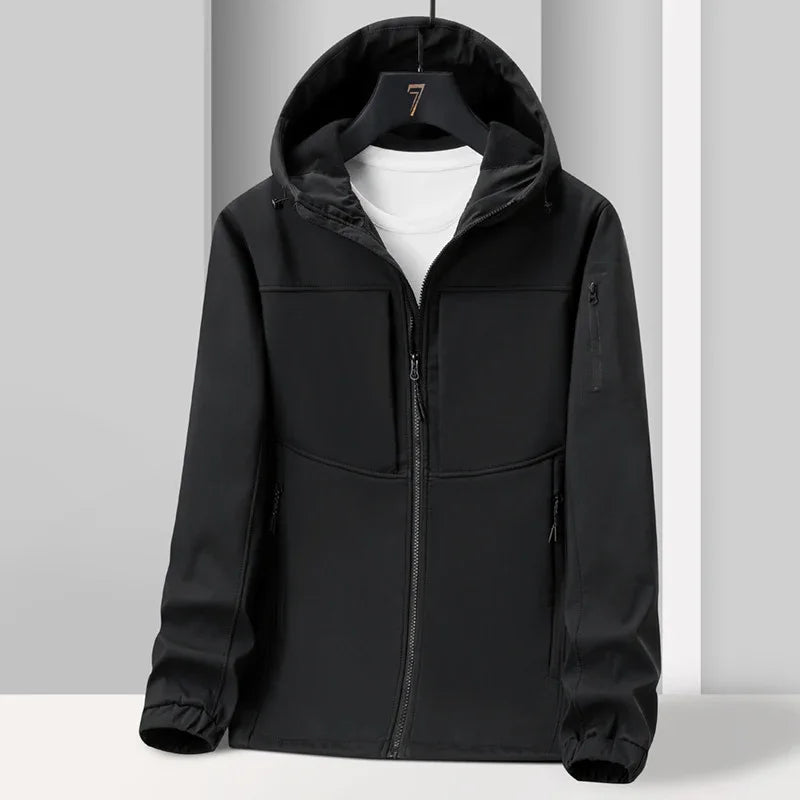 Black hooded softshell jacket with front zipper and white t-shirt inside on black hanger