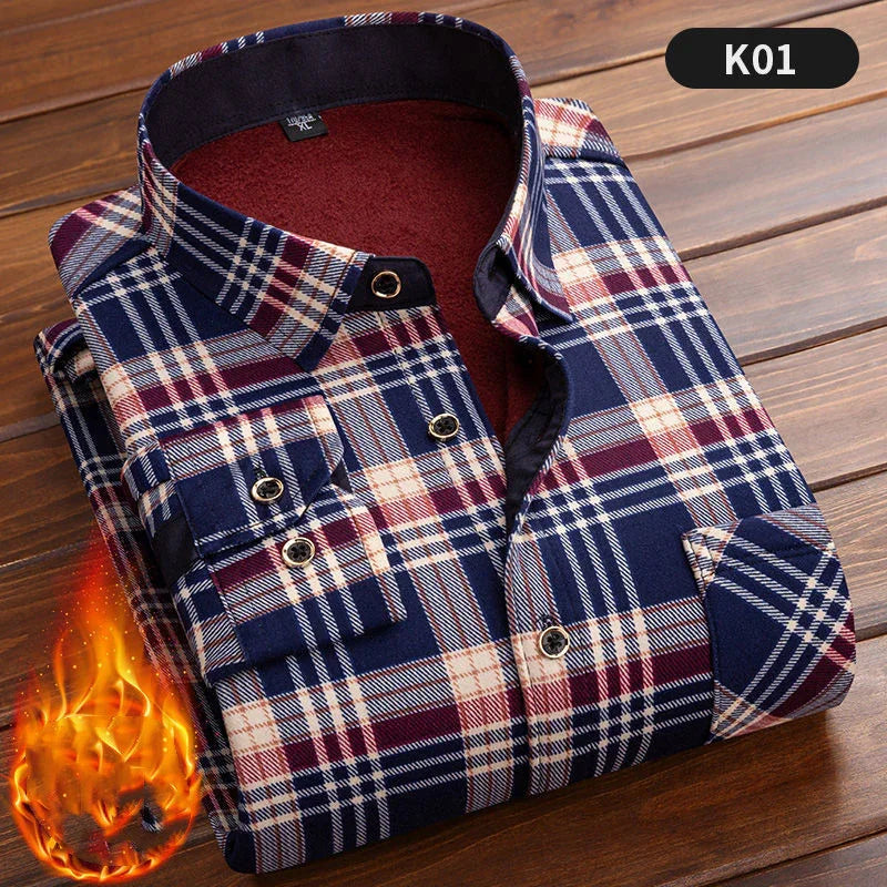 Folded thick flannel shirt with navy, red, and white plaid pattern on wooden surface