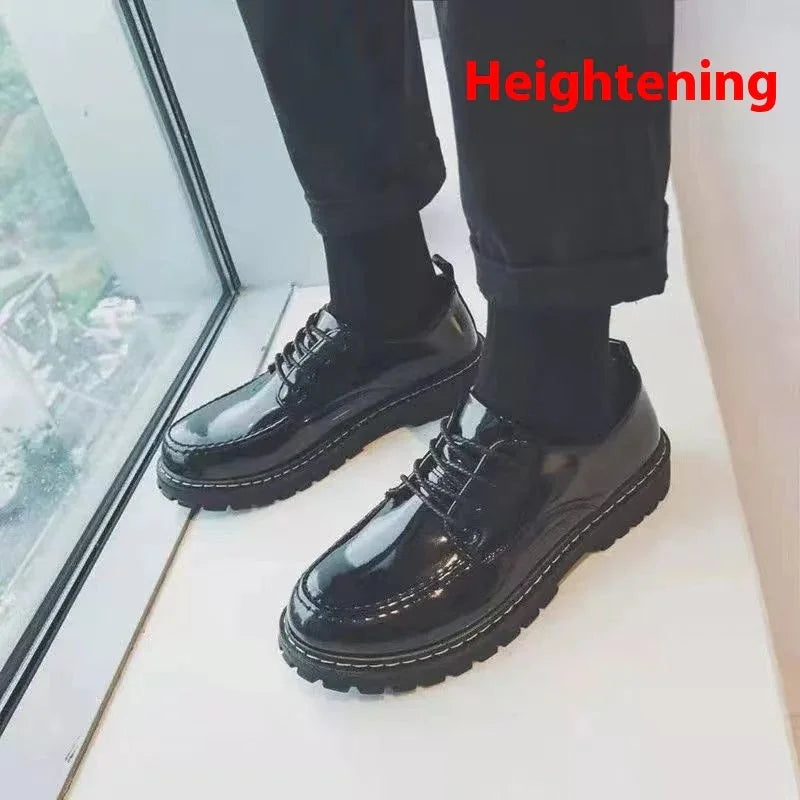 Glossy black heightening dress shoes worn with black socks and pants near window