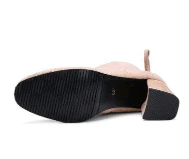 Low heel women's beige shoe showing black rubber sole with size 39 marked