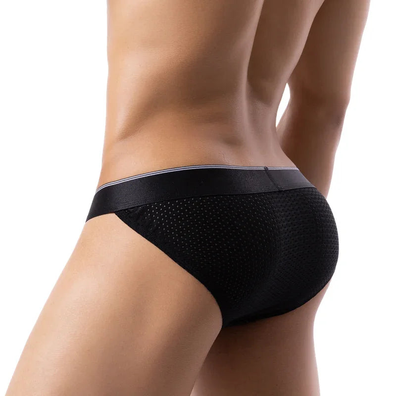 Man wearing black breathable mesh brief underwear showing back and waist profile