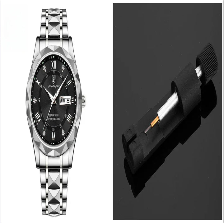 Silver stainless steel wristwatch with black dial and Roman numerals alongside a black watch spring bar tool