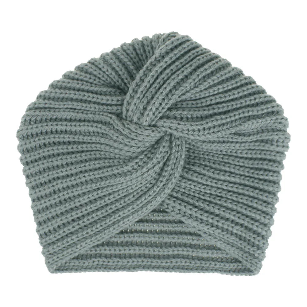 Light gray knitted turban-style headband with twisted knot detail