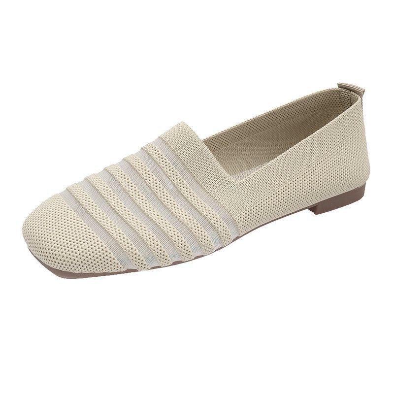 Beige knitted slip-on flat shoe with striped textured upper and brown sole