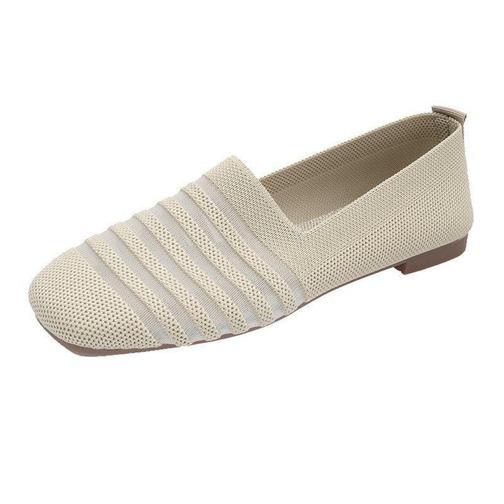 Beige knitted slip-on flat shoe with striped textured upper and brown sole