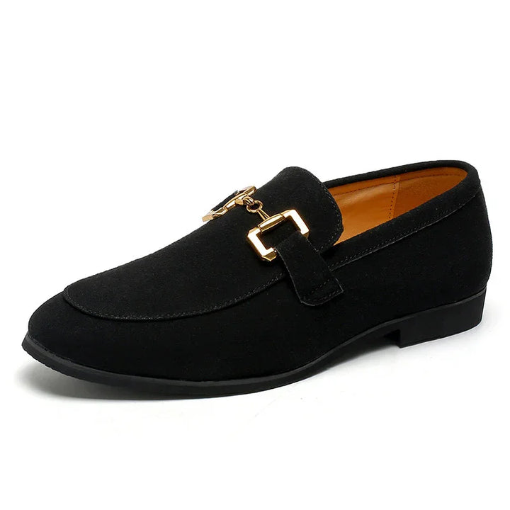 Black suede men's loafer with gold metal buckle detail and tan interior lining