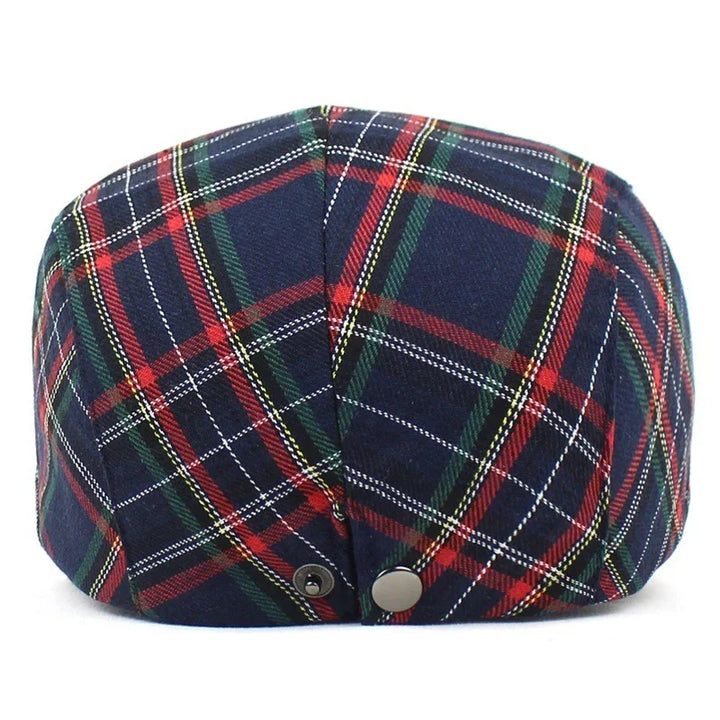 Back view of navy blue plaid flat cap with red, green, and white checks and metal buttons
