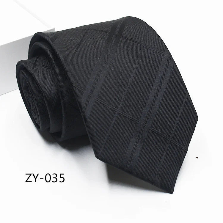 Black silk necktie with subtle diagonal check pattern, rolled and displayed on white background