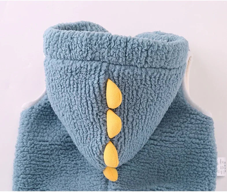 Blue fuzzy hoodie with yellow dinosaur spike details on the hood for kids