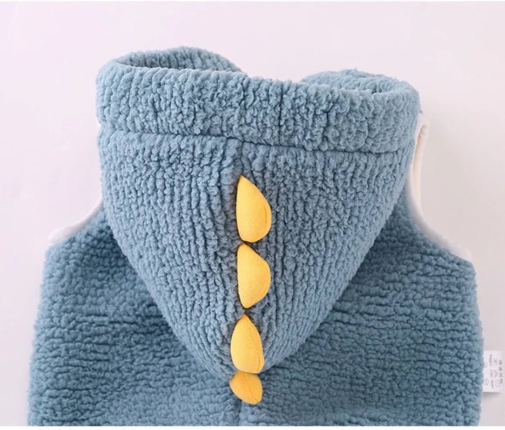 Blue fuzzy hoodie with yellow dinosaur spike details on the hood for kids