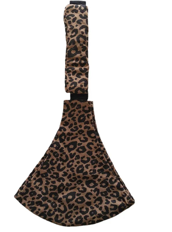 Leopard print fabric sling with adjustable strap isolated on white background
