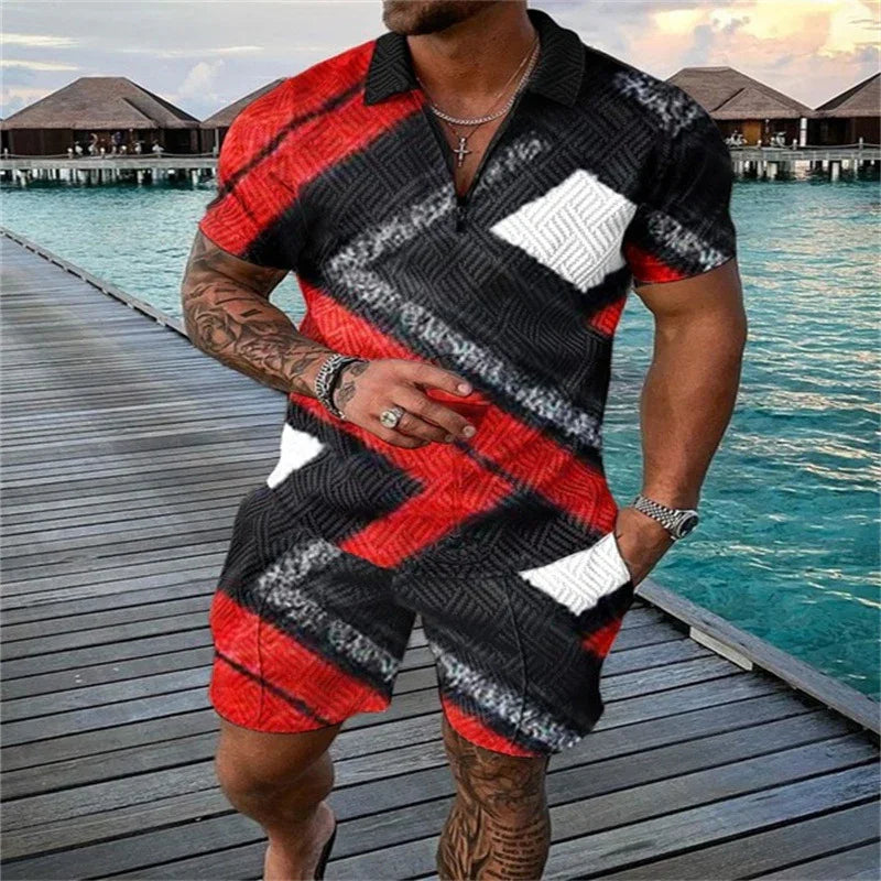 Man wearing black, red, and white patterned casual shorts and polo shirt on a wooden pier over blue water