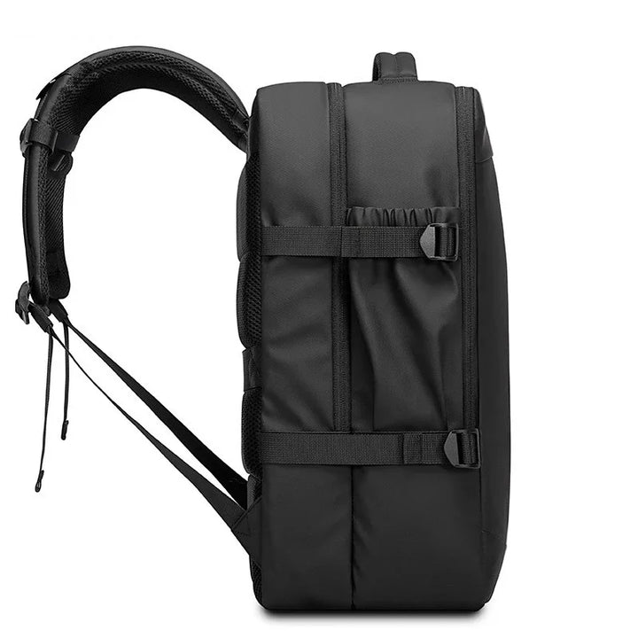 Side view of sleek black backpack with padded shoulder straps and adjustable buckles
