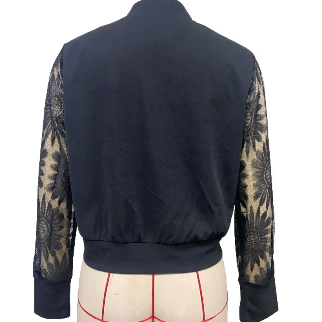 Black jacket with solid back and sheer lace floral pattern long sleeves on mannequin