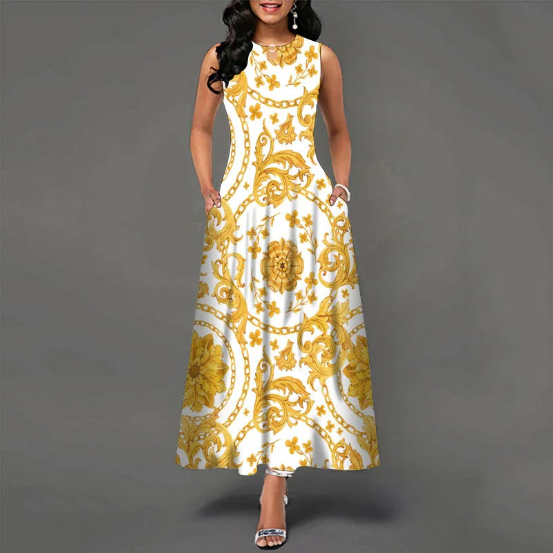 Woman wearing sleeveless white maxi dress with ornate yellow floral and chain pattern, standing on gray background
