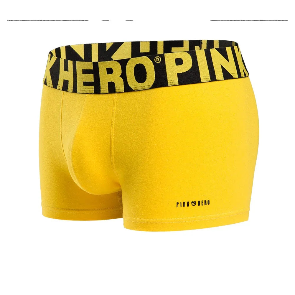 Bright yellow men's boxer briefs with black waistband featuring PINK HERO branding