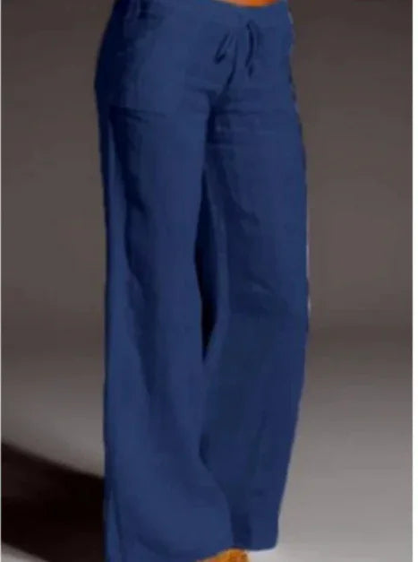 woman wearing loose fit navy blue scrub pants with drawstring waist