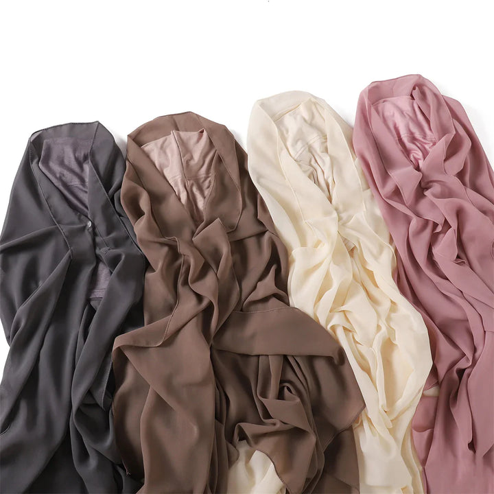 Four soft chiffon hijabs in gray, brown, cream, and dusty pink colors displayed flat