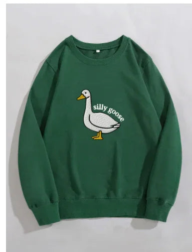 Green sweatshirt featuring a white embroidered goose with the text 'silly goose' in casual style