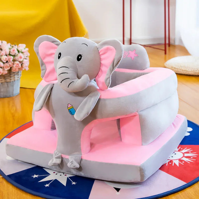Gray and pink plush elephant baby walker on colorful round rug in bright room