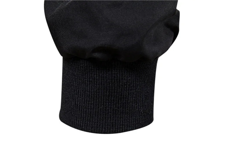 Close-up of black sweatshirt cuff with ribbed knit fabric detail on sleeve