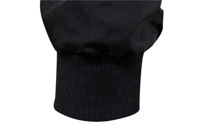 Close-up of black sweatshirt cuff with ribbed knit fabric detail on sleeve