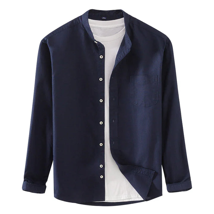 navy blue mandarin collar shirt over white t-shirt with button-down front and chest pocket