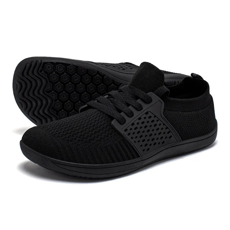 Black lightweight breathable knit sneakers with rubber soles and lace-up design