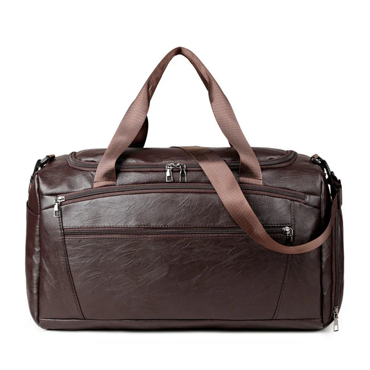 dark brown leather travel duffel bag with zippered pockets and brown fabric handles and shoulder strap