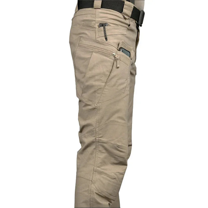 close-up of beige tactical cargo pants with multiple pockets and a black belt