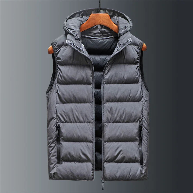 gray padded sleeveless puffer vest with hood hanging on wooden hanger